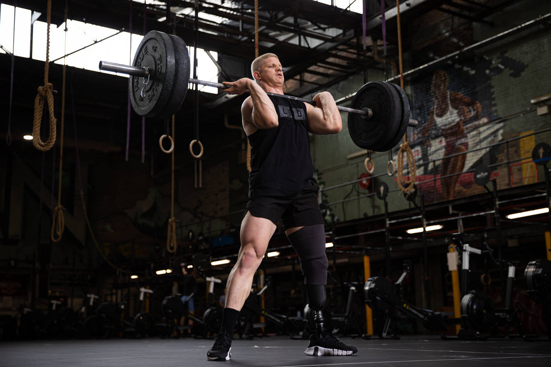 man lifting a barbell of weights