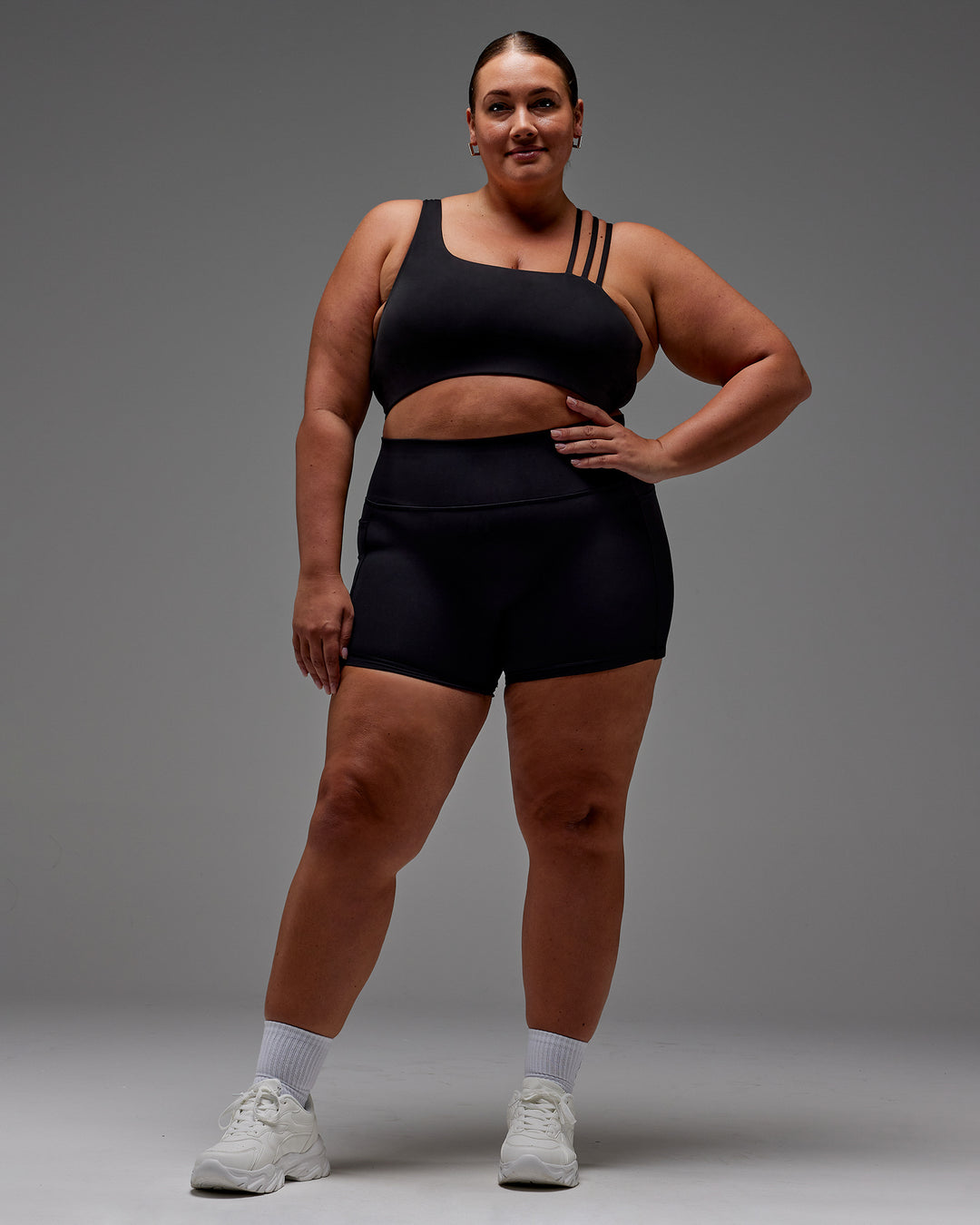 Woman wearing Fusion Ultra High-Rise 4" Short Pockets - Black | Model:Jordie | Size:2XL