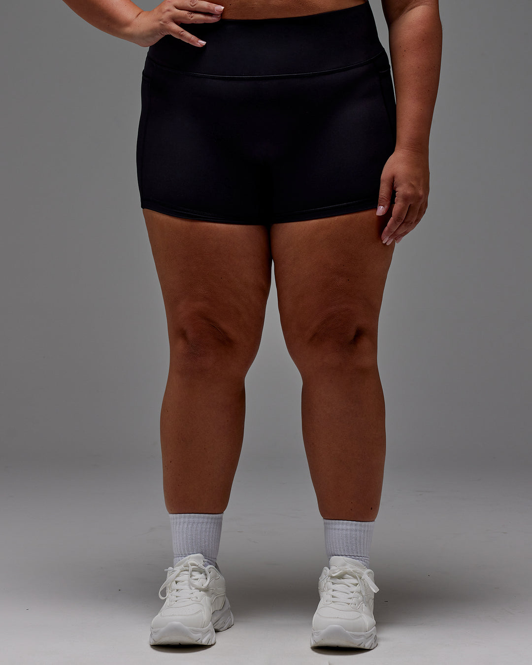 Woman wearing Fusion Ultra High-Rise 4" Short Pockets - Black | Model:Jordie | Size:2XL