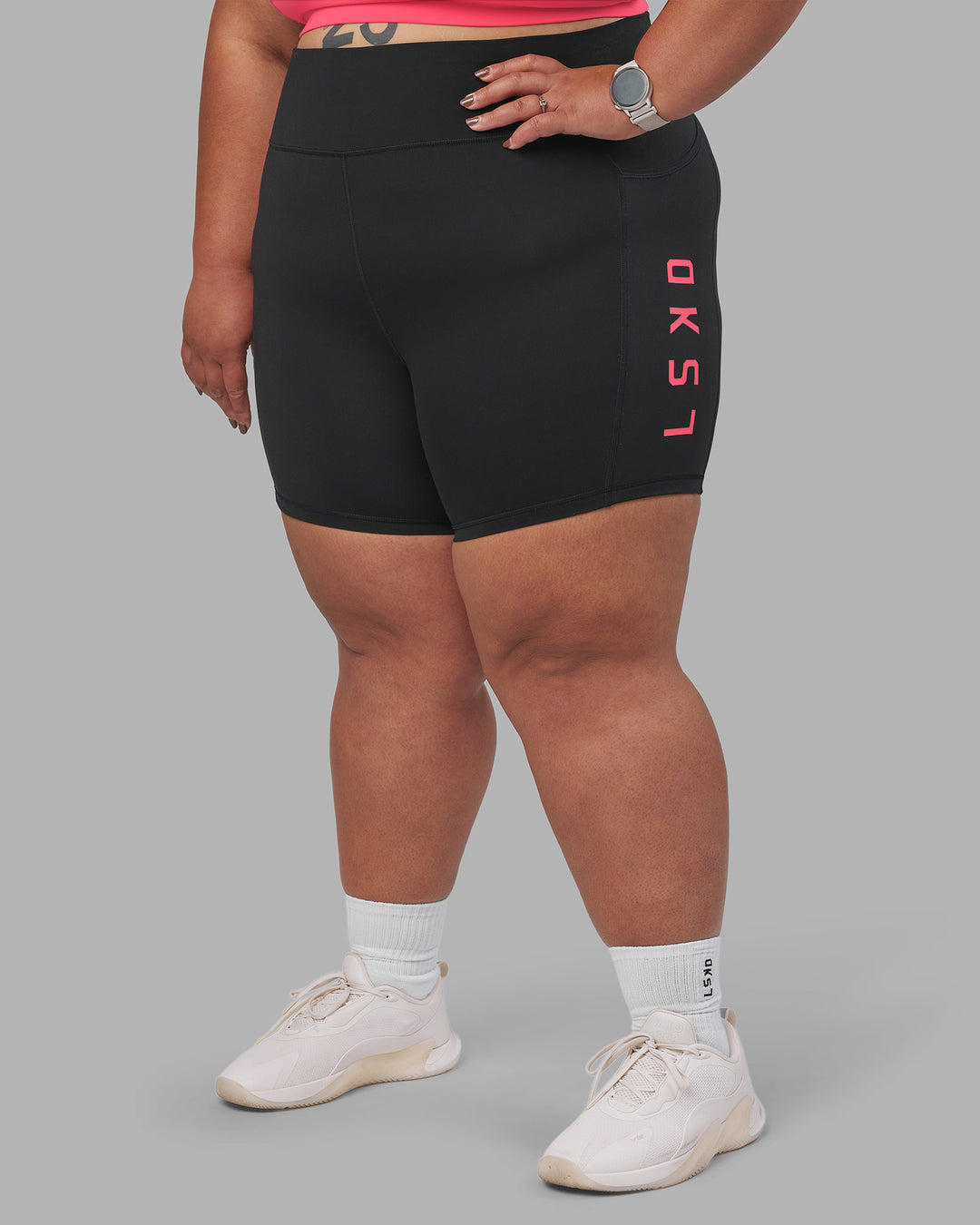 Woman wearing Rep Ultra High-Rise 6" Short Pockets - Black-Bright Raspberry | Model:Lilz | Size:3XL