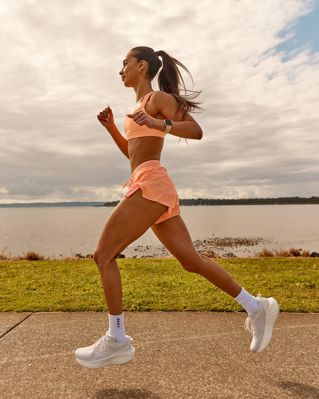 Woman wearing Accelerate 3" Running Short - Cantaloupe | Model: | Size: