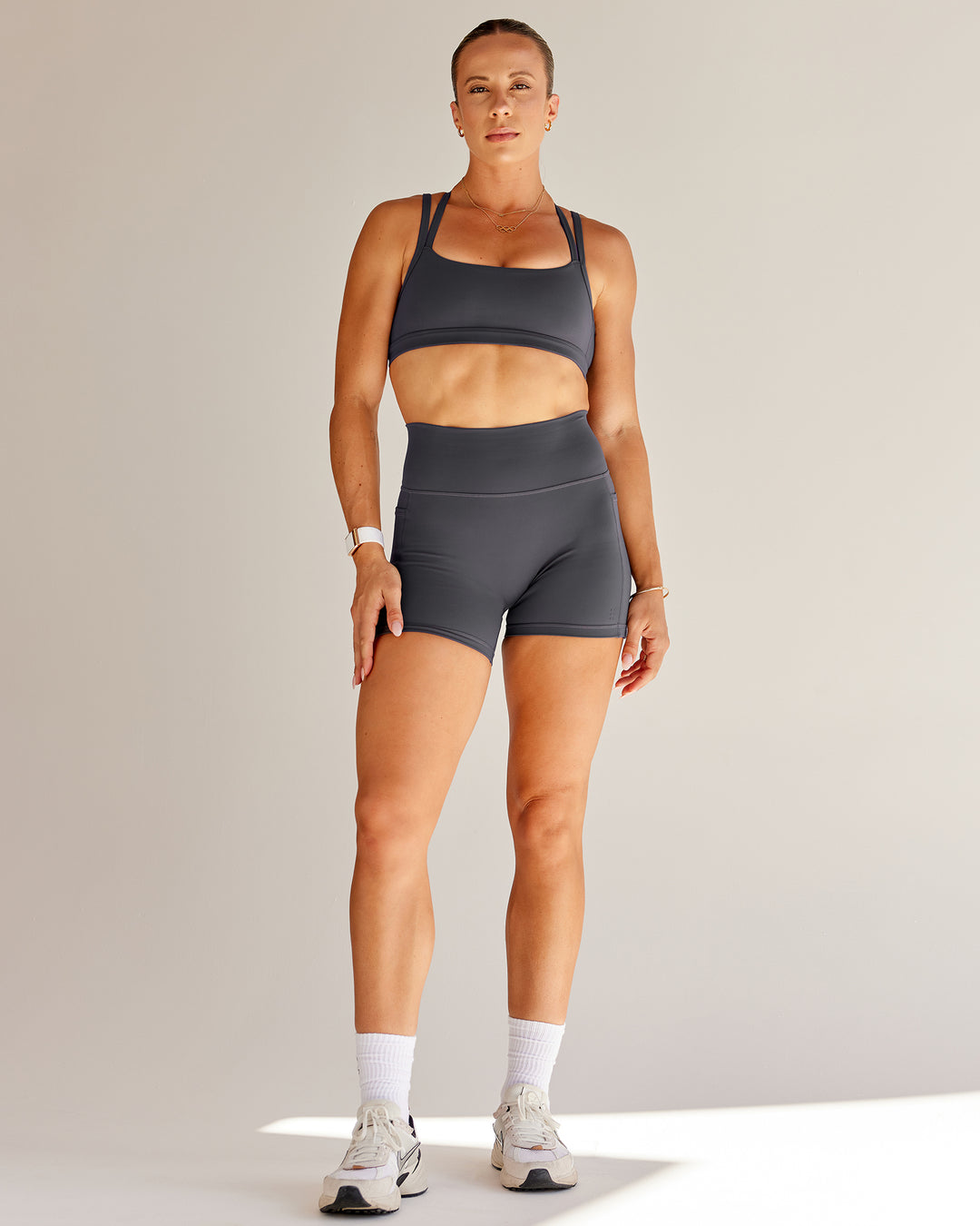 Woman wearing Bree Masters Fusion Ultra High-Rise 4" Short Pockets - Stormy