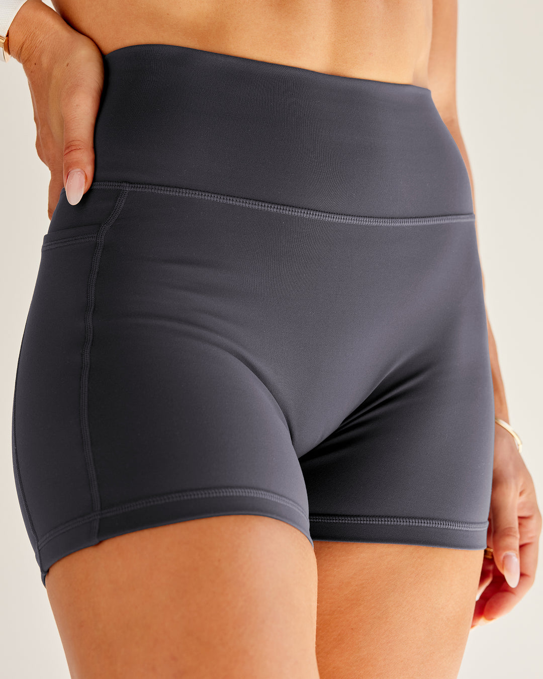 Woman wearing Bree Masters Fusion Ultra High-Rise 4" Short Pockets - Stormy