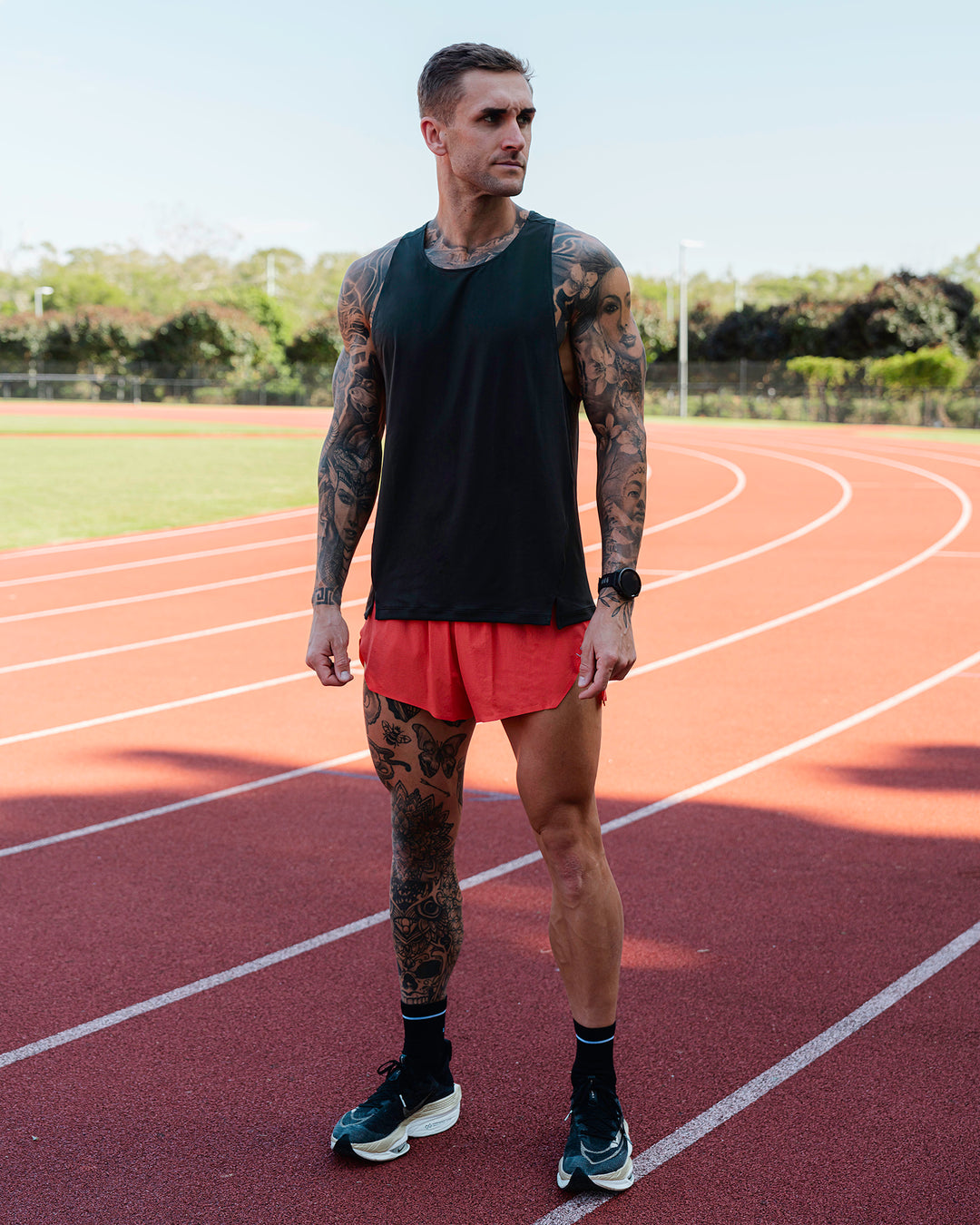 Man wearing Race Day 3" Lined Running Shorts - Cayenne