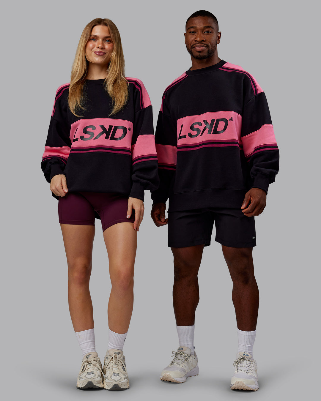 Duo wearing A-Team Sweater Oversize - Black-Hot Pink | Model:Both | Size:Duo