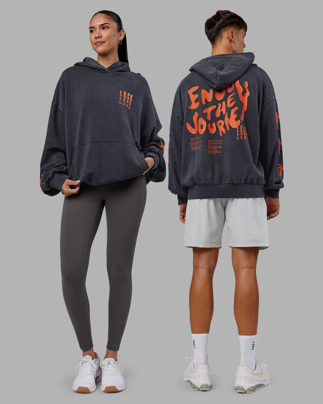 Duo wearing Journey Washed Unisex Oversize Hoodie - Black-Ultra Orange | Model:Both | Size:Duo