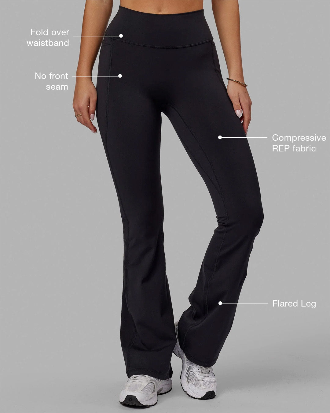 Woman wearing Fusion Ultra High-Rise Flared Legging Pockets - Black | Model:Milly | Size:S