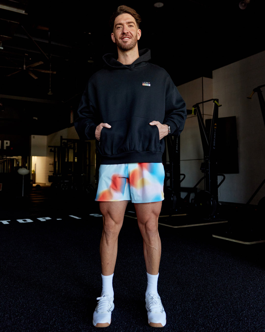 Man wearing Fitstop Unstoppable Together Oversized Hoodie - Black | Model:Billy | Size:L