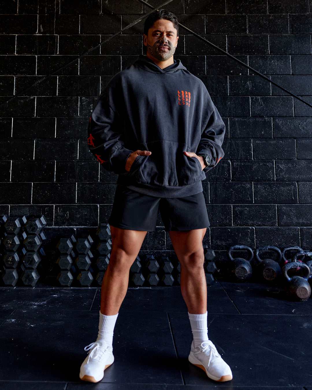 Man wearing Journey Washed Unisex Oversize Hoodie - Black-Ultra Orange | Model:Hiko | Size:L