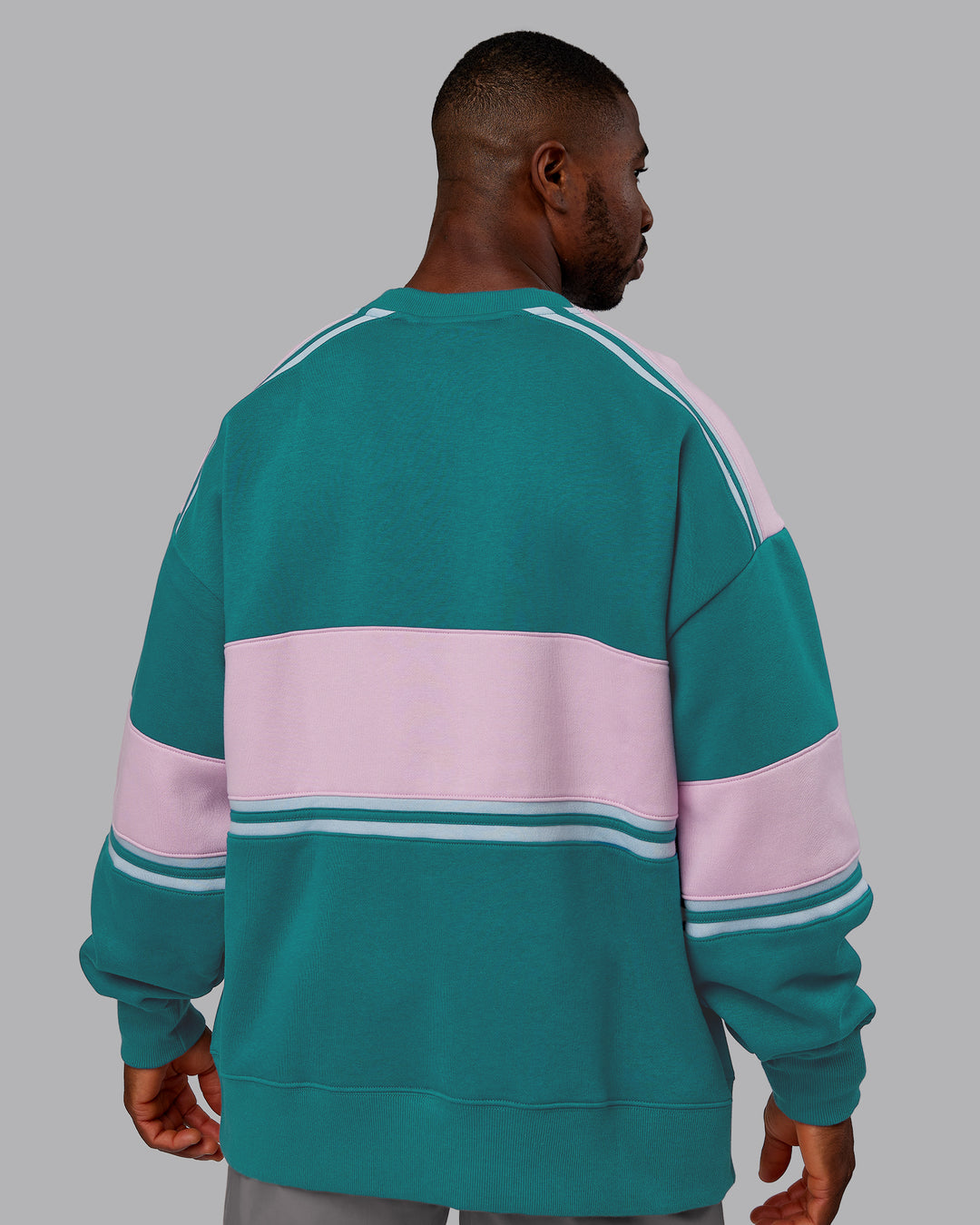 Man wearing A-Team Sweater Oversize - Blue Coral-Festival Bloom | Model:Sam | Size:L