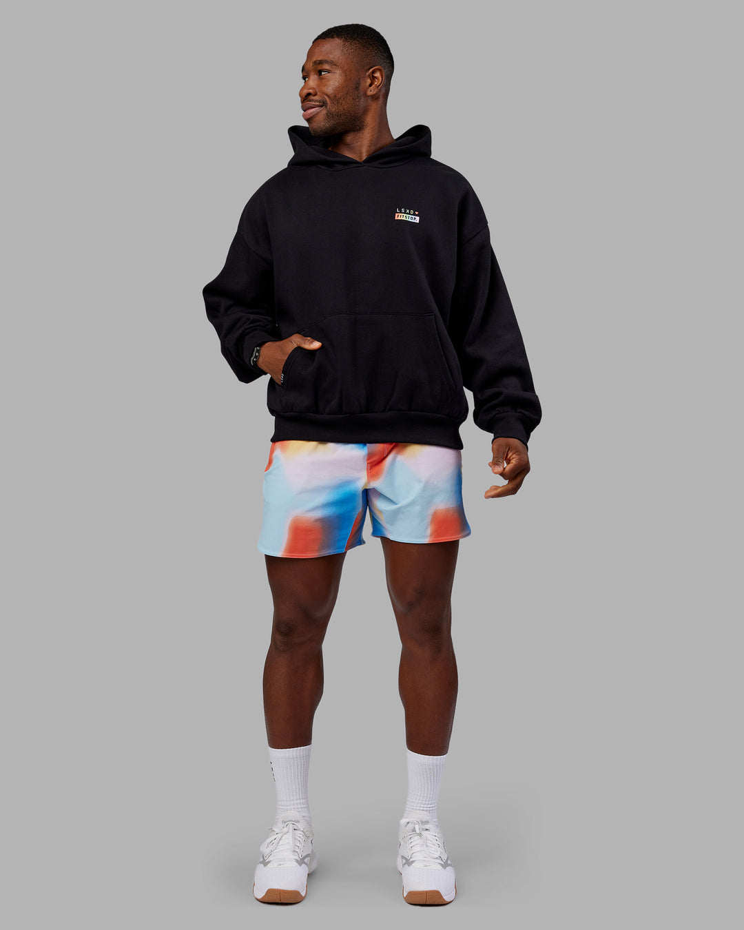 Man wearing Fitstop Unstoppable Together Oversized Hoodie - Black | Model:Sam | Size:L