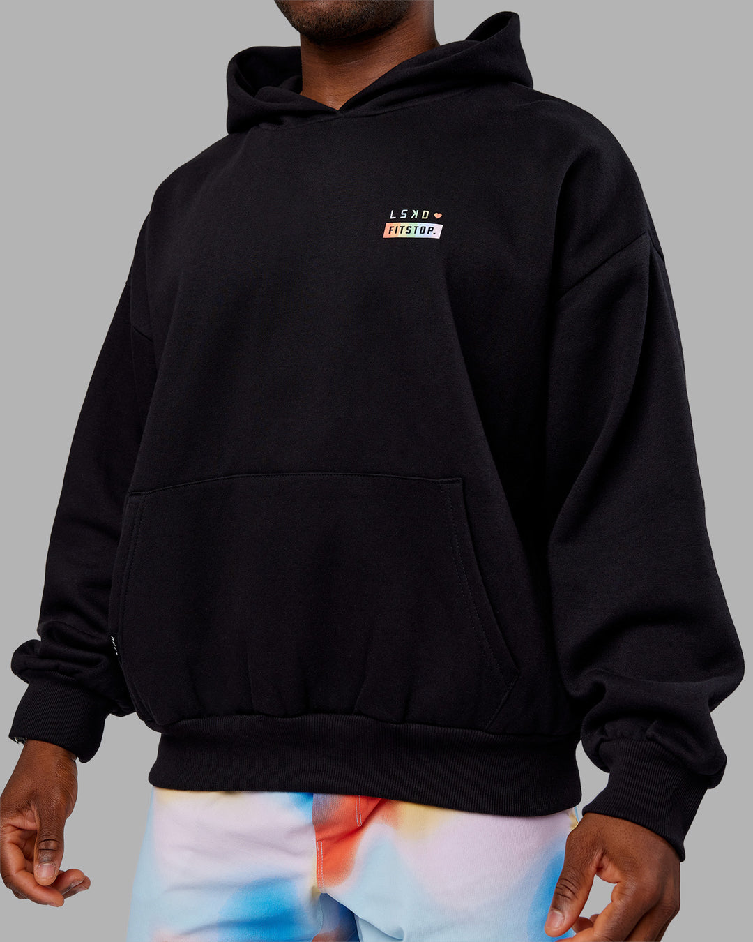 Man wearing Fitstop Unstoppable Together Oversized Hoodie - Black | Model:Sam | Size:L
