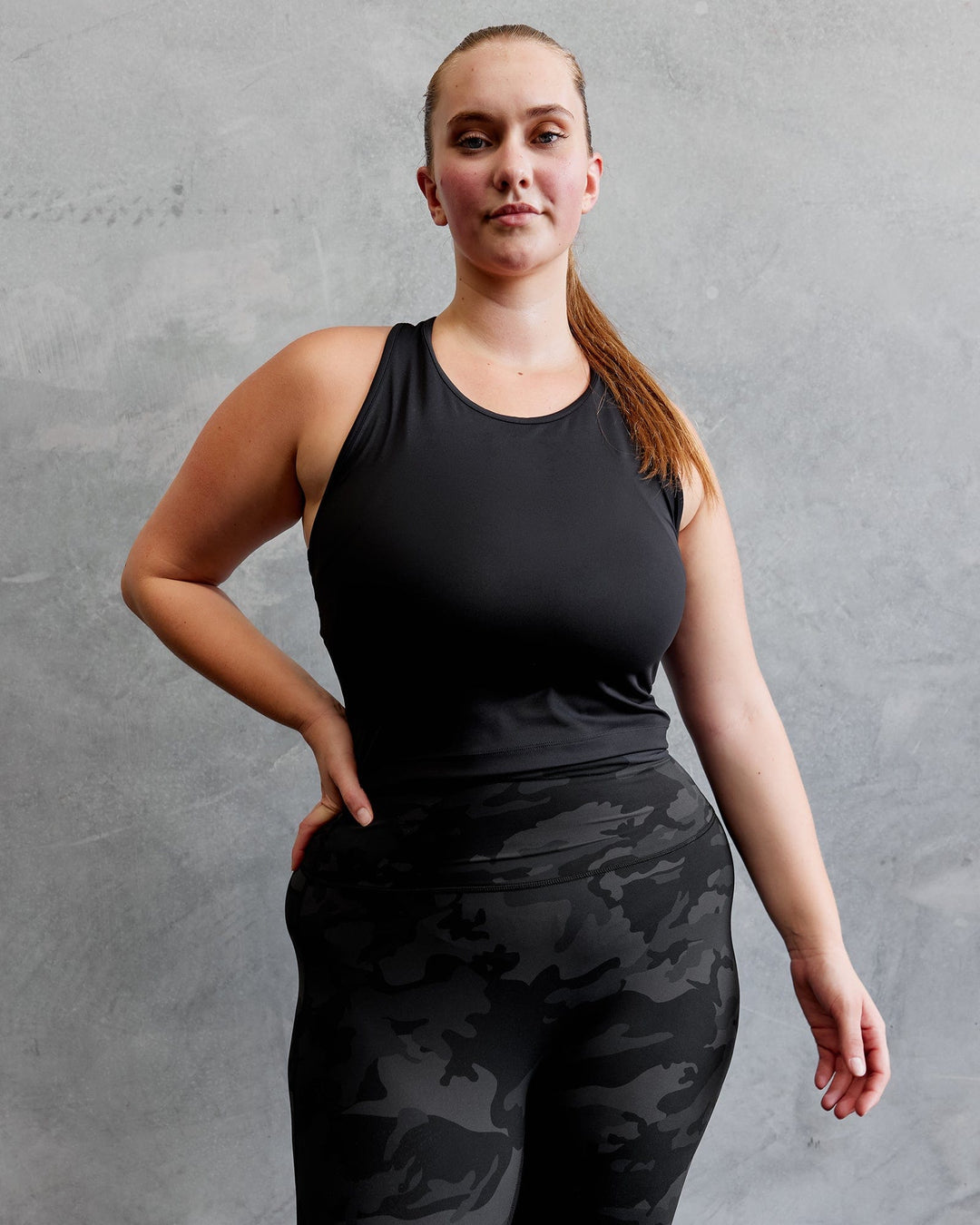 Woman wearing Flow Performance Tank - Black