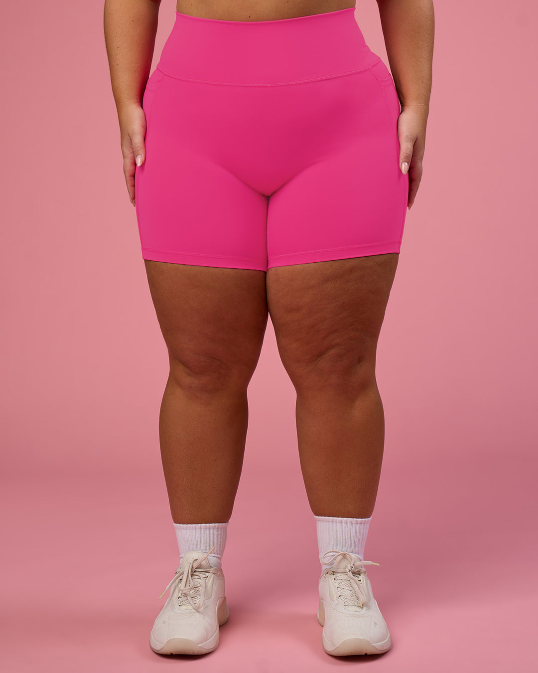 Woman wearing Fusion Ultra High-Rise 6" Short Pockets - Ultra Pink | Model:Bianca | Size:L
