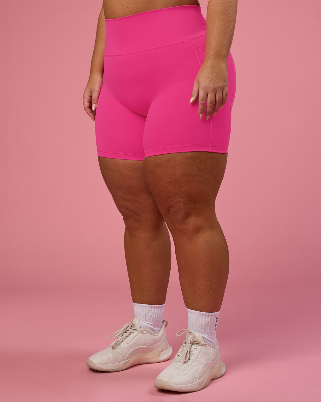 Woman wearing Fusion Ultra High-Rise 6" Short Pockets - Ultra Pink | Model:Bianca | Size:L