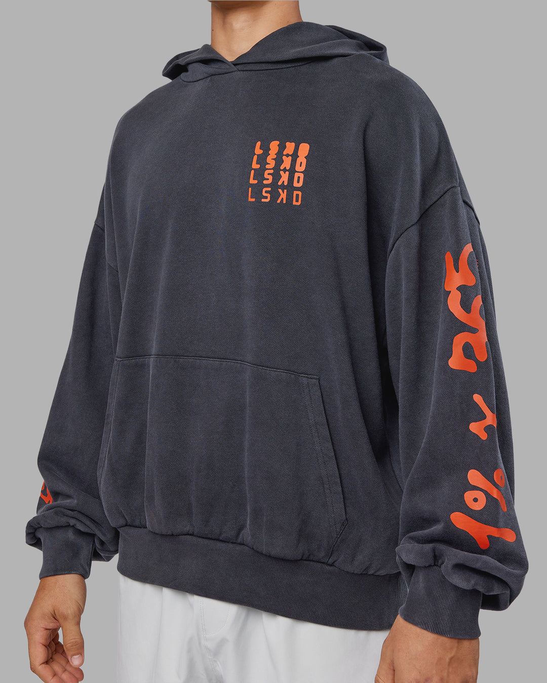 Man wearing Journey Washed Unisex Oversize Hoodie - Black-Ultra Orange | Model:Jackson | Size:L