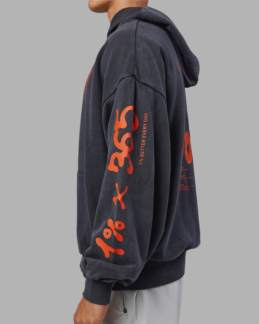 Man wearing Journey Washed Unisex Oversize Hoodie - Black-Ultra Orange | Model:Jackson | Size:L
