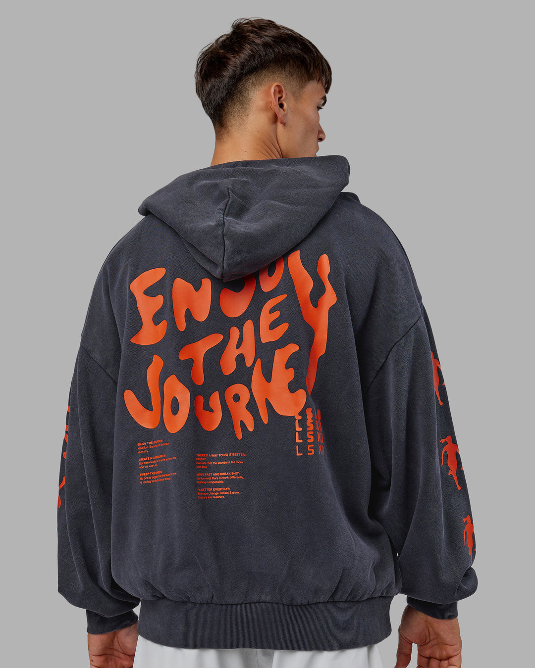 Man wearing Journey Washed Unisex Oversize Hoodie - Black-Ultra Orange | Model:Jackson | Size:L