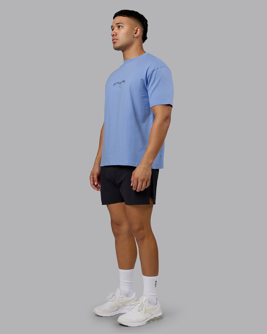 Man wearing Just Run FLXCotton Oversized Tee - Soft Blue-Dark Storm | Model:Kaelyb | Size:L