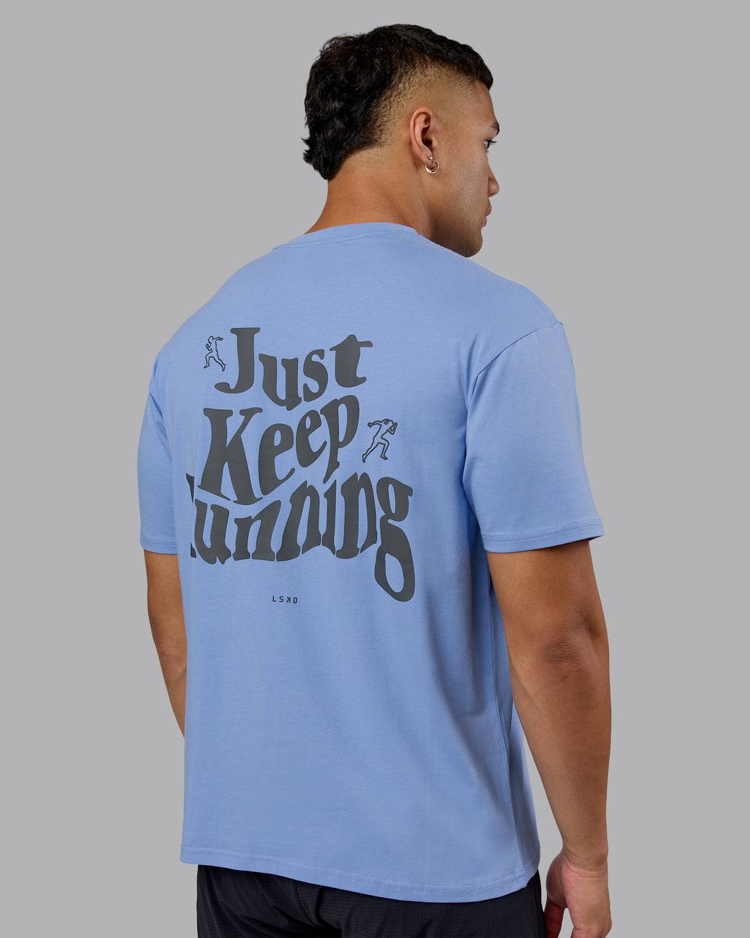 Man wearing Just Run FLXCotton Oversized Tee - Soft Blue-Dark Storm | Model:Kaelyb | Size:L
