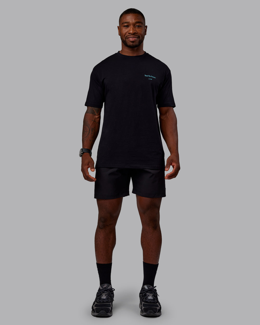 Man wearing Trust The Process 2.0 FLXCotton Tee Oversize - Black-Blue Atoll | Model:Sam | Size:L