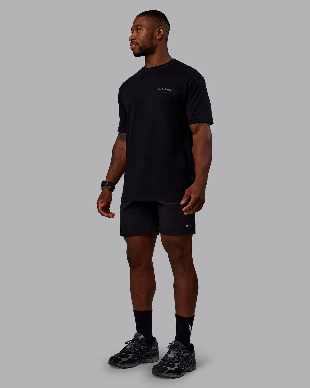 Man wearing Trust The Process 2.0 FLXCotton Tee Oversize - Black-Blue Atoll | Model:Sam | Size:L