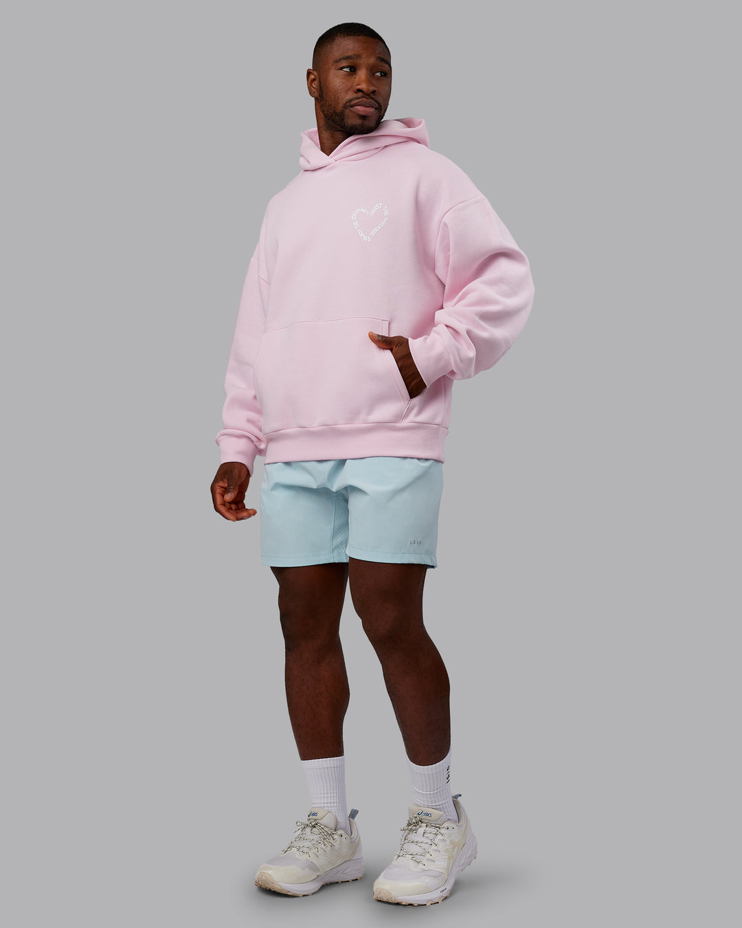 Man wearing Unisex Love The Process Oversize Hoodie - Petal Pink-White | Model:Sam | Size:L