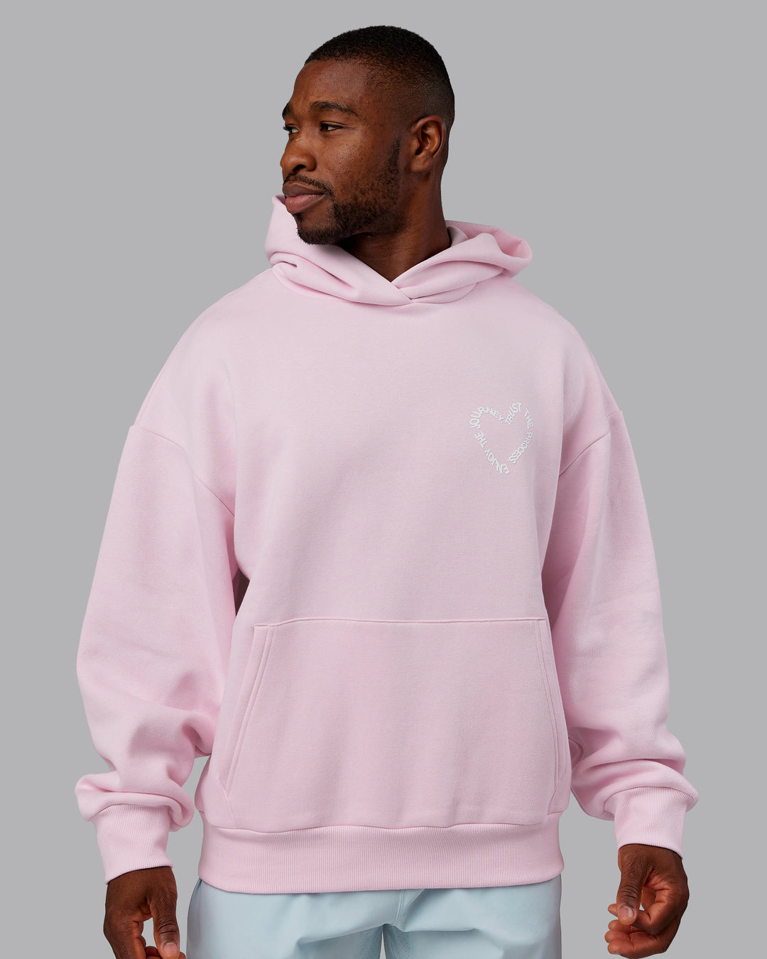 Man wearing Unisex Love The Process Oversize Hoodie - Petal Pink-White | Model:Sam | Size:L