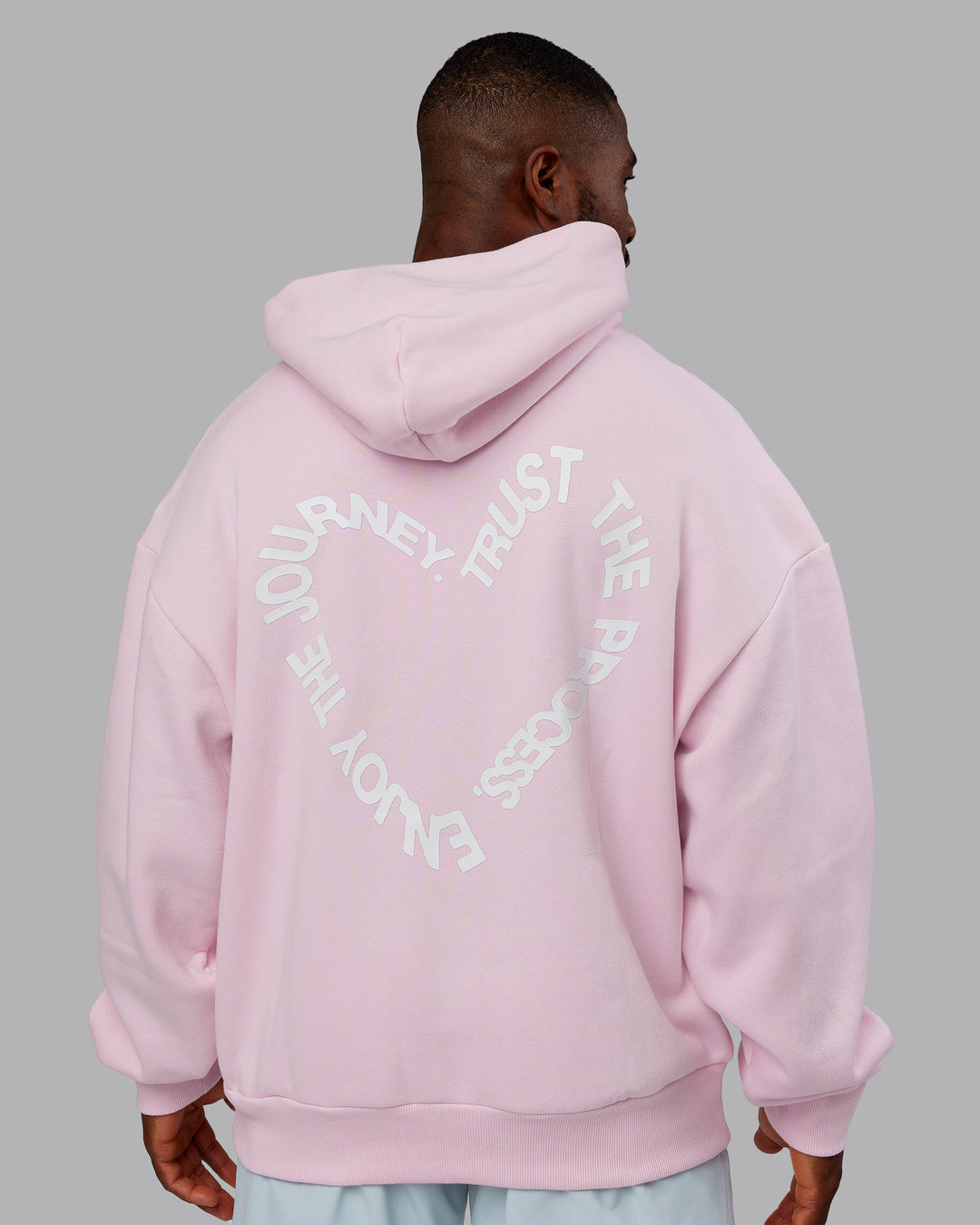 Man wearing Unisex Love The Process Oversize Hoodie - Petal Pink-White | Model:Sam | Size:L