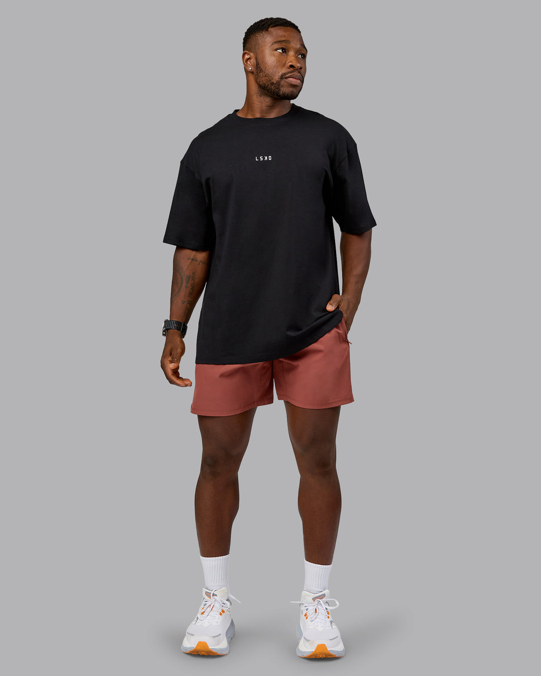 Man wearing On Repeat FLXCotton Oversized Tee - Black-Mahogany | Model:Sam | Size:L