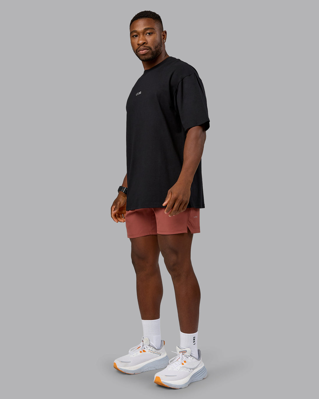 Man wearing On Repeat FLXCotton Oversized Tee - Black-Mahogany | Model:Sam | Size:L