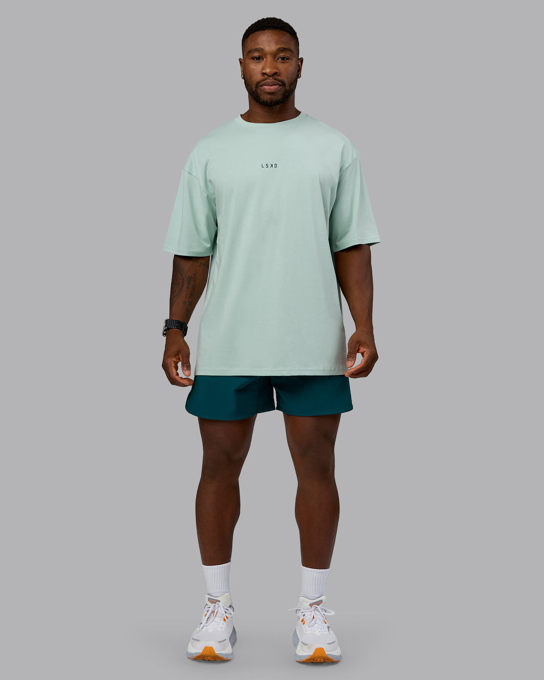 Man wearing On Repeat FLXCotton Oversized Tee - Blue Haze-Dark Moss | Model:Sam | Size:L