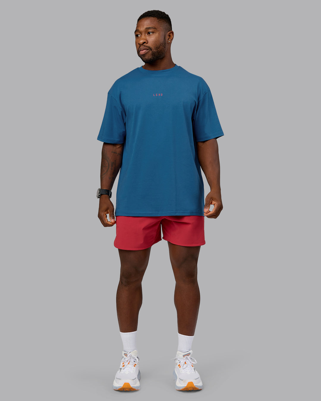 Man wearing On Repeat FLXCotton Oversized Tee - High Tide-Claret | Model:Sam | Size:L