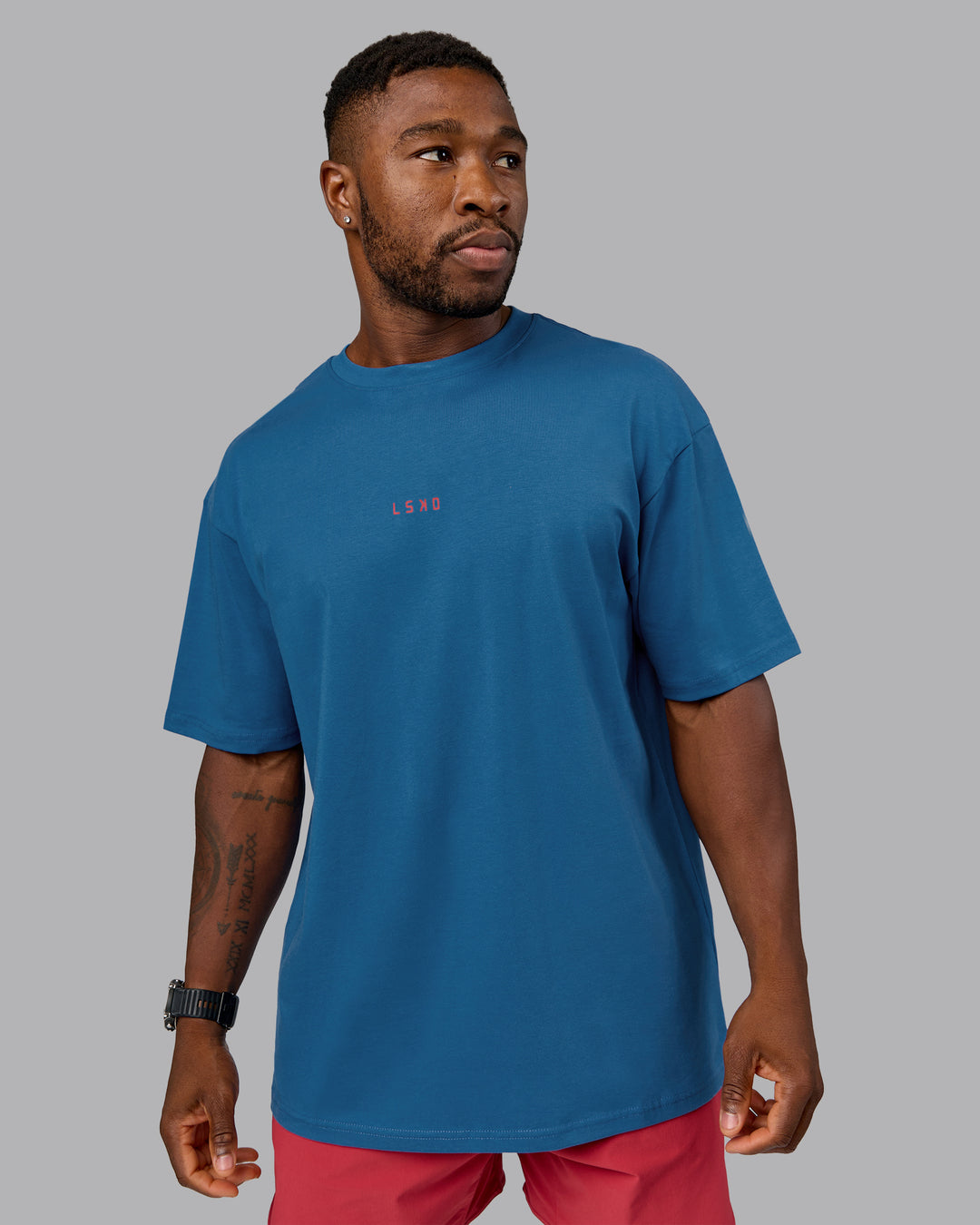 Man wearing On Repeat FLXCotton Oversized Tee - High Tide-Claret | Model:Sam | Size:L