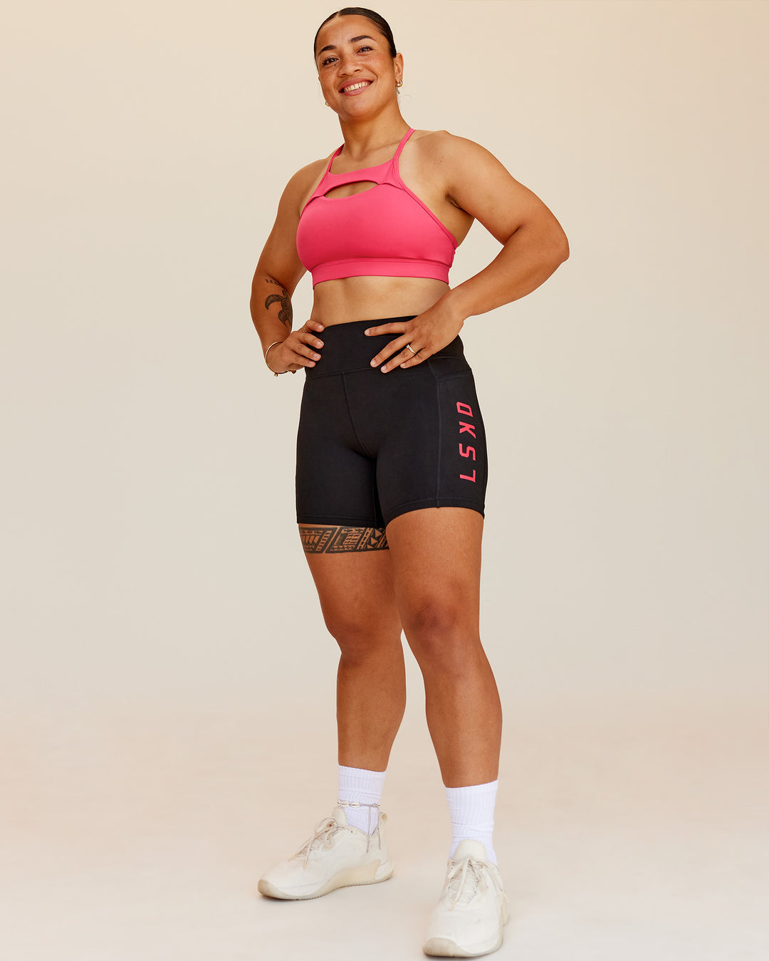 Woman wearing Rep Ultra High-Rise 6" Short Pockets - Black-Bright Raspberry | Model:Barbra | Size:M