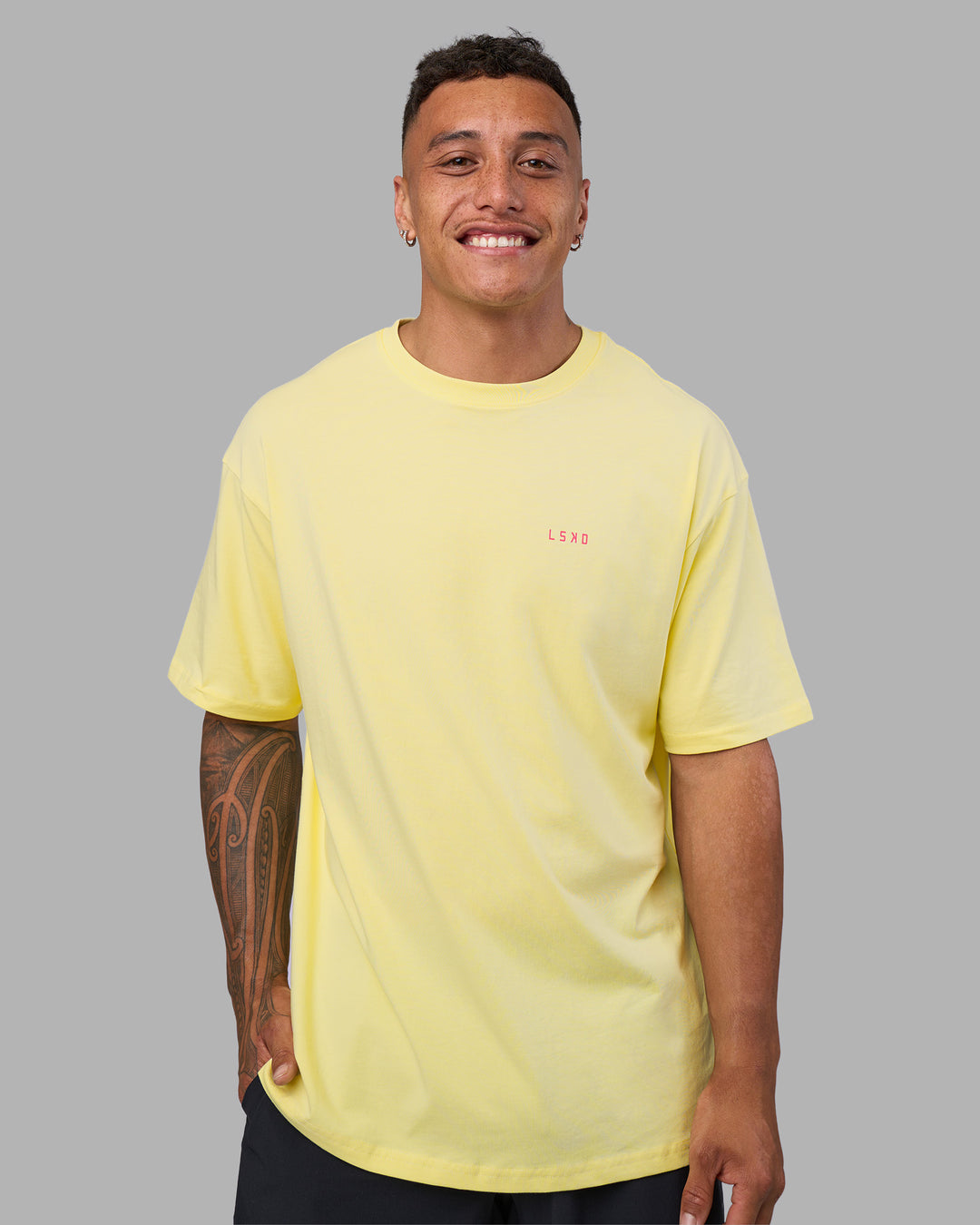 Man wearing Bold Brave and Kind FLXCotton Oversized Tee - Lemon Fizz | Model:Daarian | Size:M