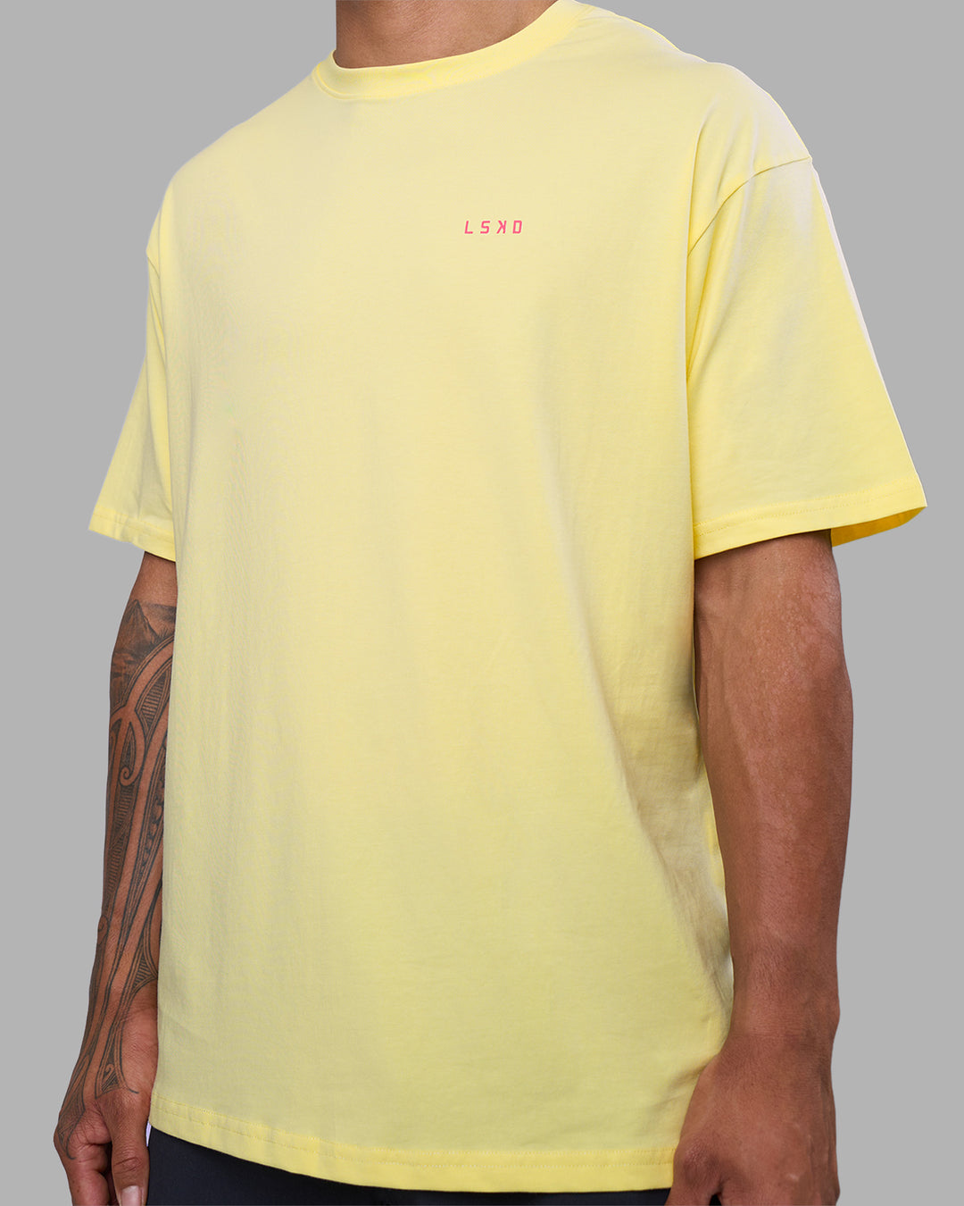 Man wearing Bold Brave and Kind FLXCotton Oversized Tee - Lemon Fizz | Model:Daarian | Size:M