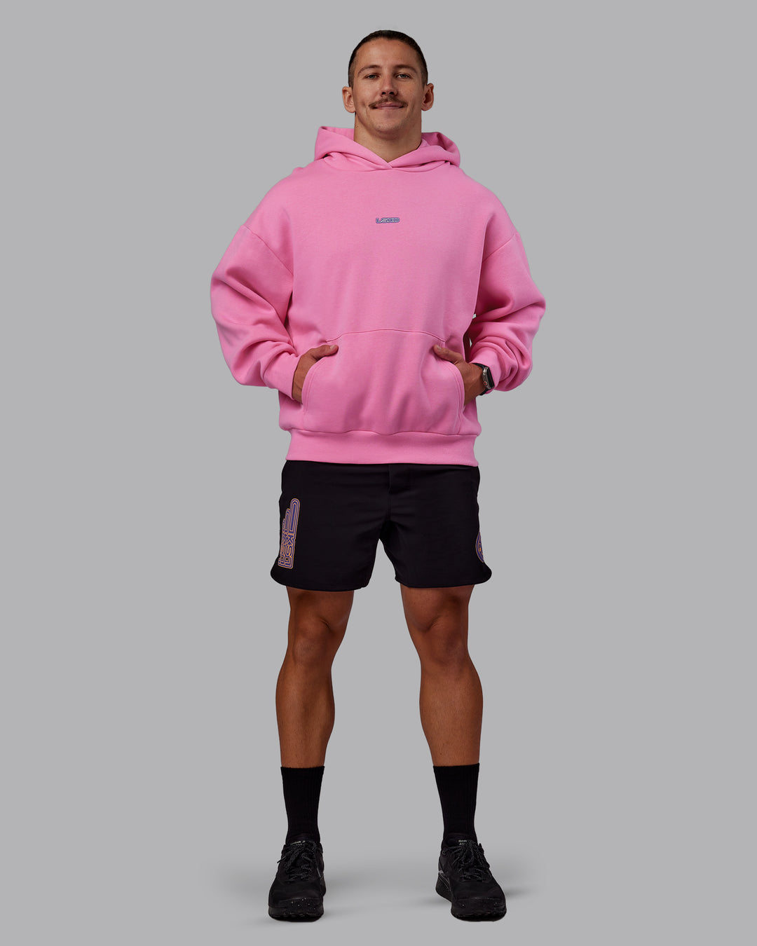 Man wearing CFT BNE 25 Oversized Hoodie - Candy Pink-Purple Opulence | Model:Jaiden | Size:M