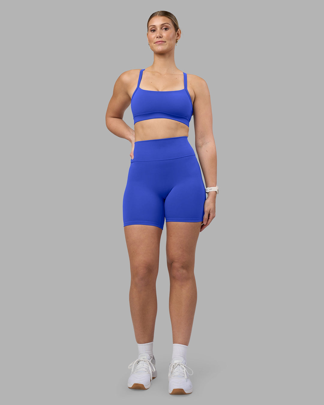 Woman wearing Fusion Ultra High-Rise 6" Short - Power Cobalt | Model:Amy | Size:M