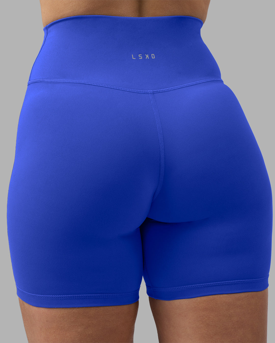 Woman wearing Fusion Ultra High-Rise 6" Short - Power Cobalt | Model:Amy | Size:M