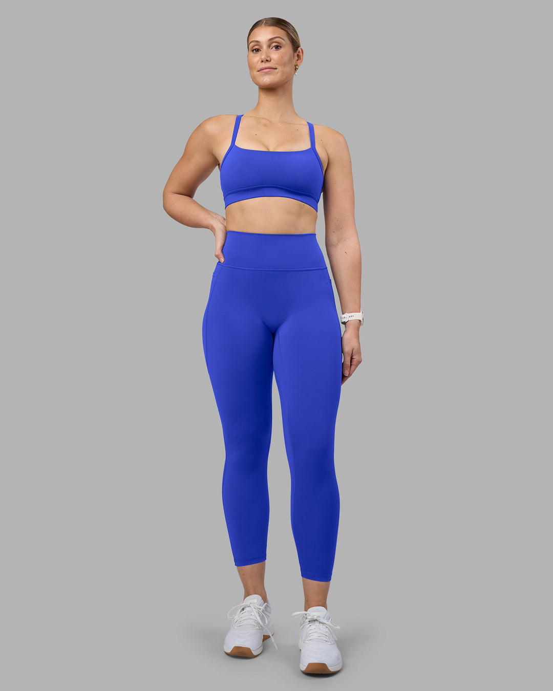 Woman wearing Fusion Ultra High-Rise 7/8 Legging Pockets - Power Cobalt | Model:Amy | Size:M