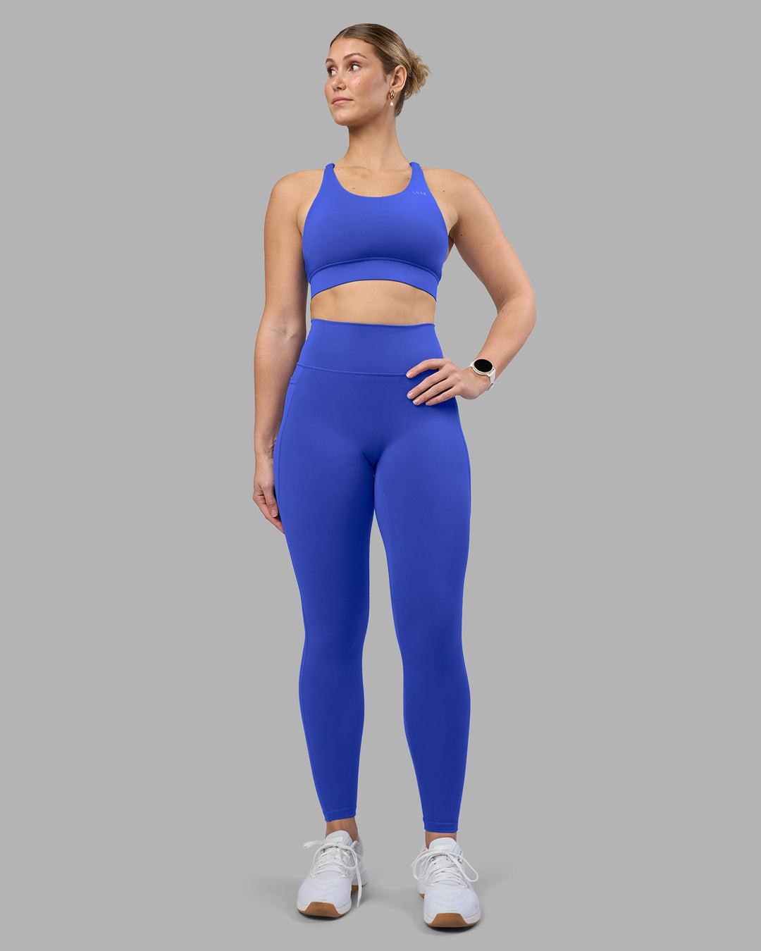 Woman wearing Fusion Ultra High-Rise Full Length Legging Pockets - Power Cobalt | Model:Amy | Size:M