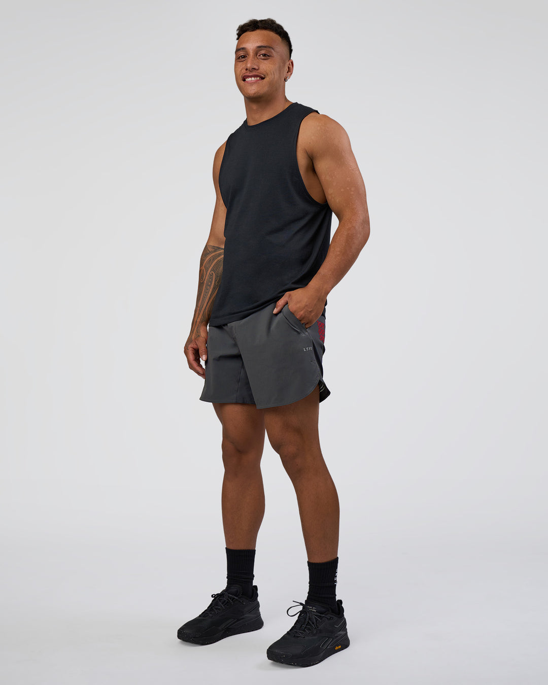 Man wearing Lift 6" Short - Dark Storm-Scarlet | Model:Daarian | Size:M