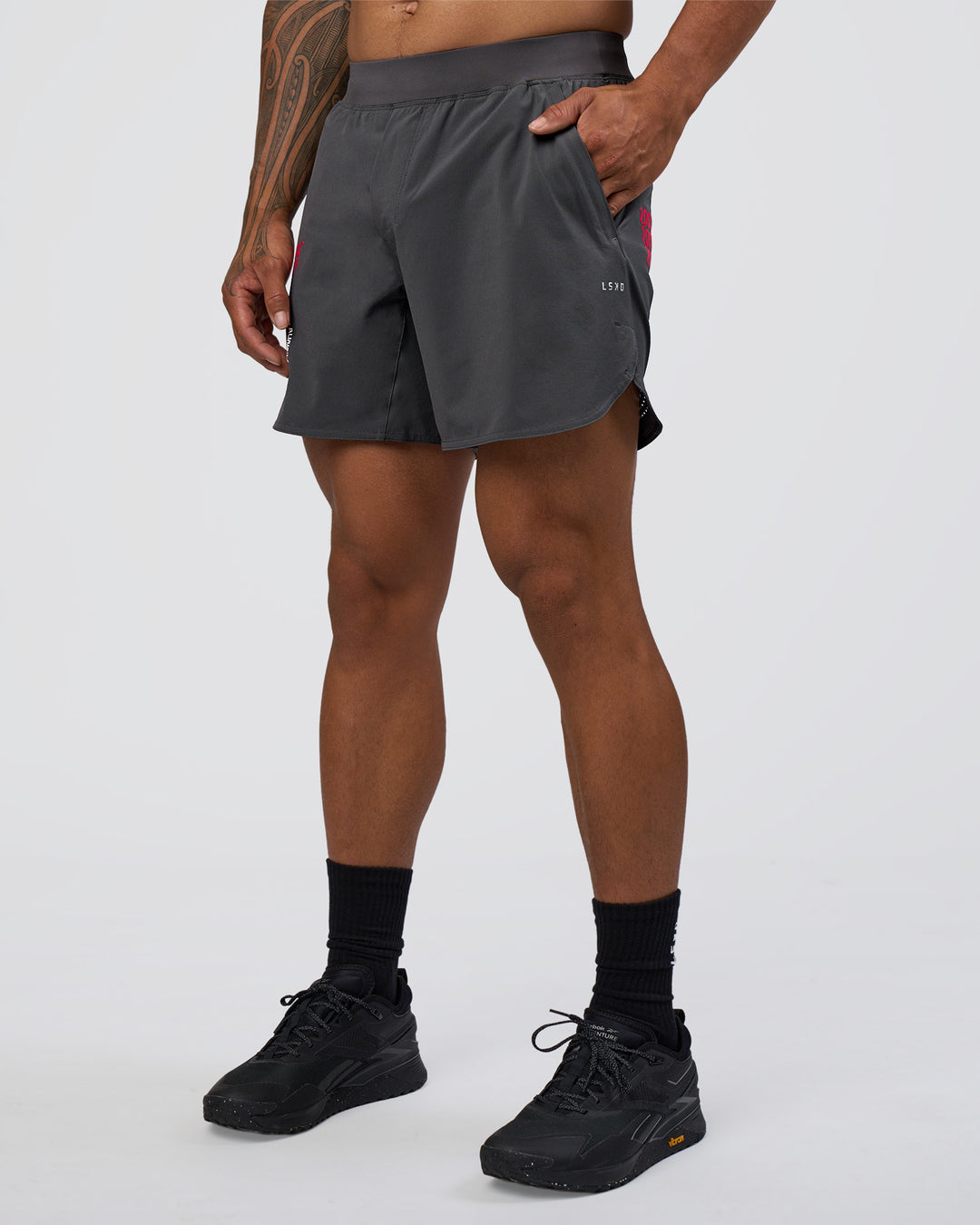Man wearing Lift 6" Short - Dark Storm-Scarlet | Model:Daarian | Size:M