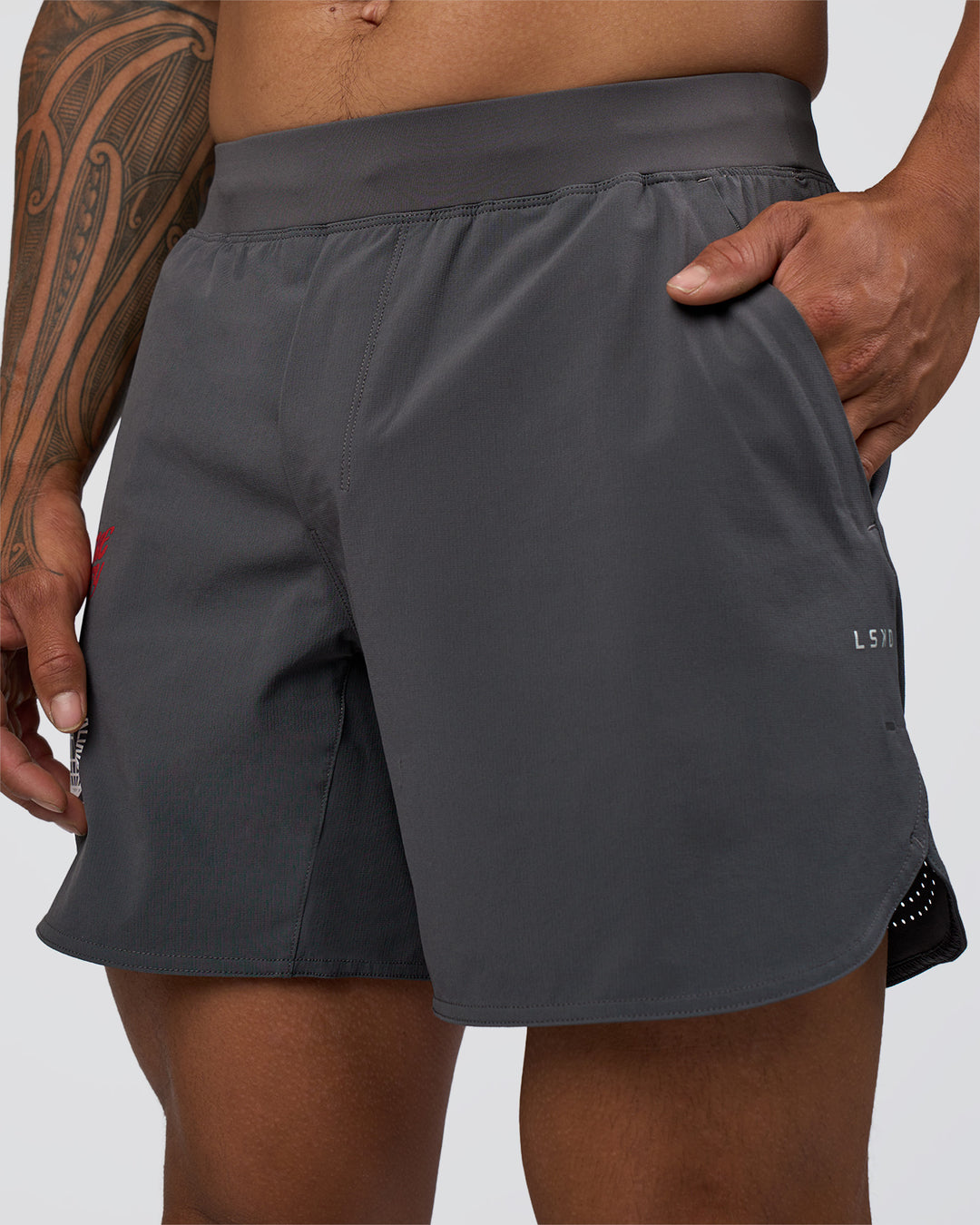Man wearing Lift 6" Short - Dark Storm-Scarlet | Model:Daarian | Size:M