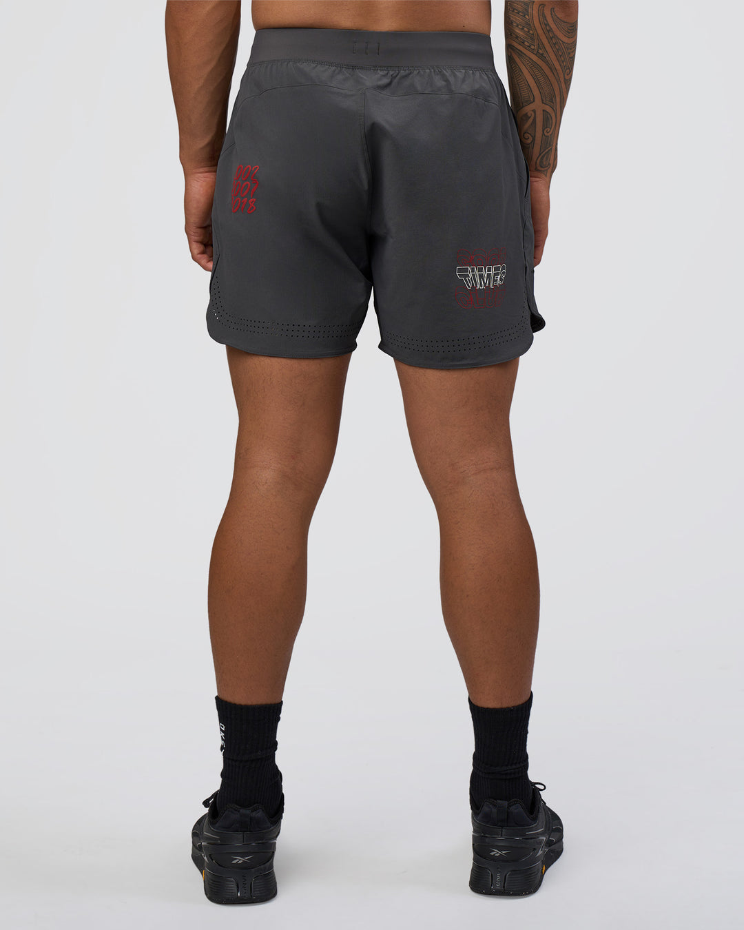 Man wearing Lift 6" Short - Dark Storm-Scarlet | Model:Daarian | Size:M