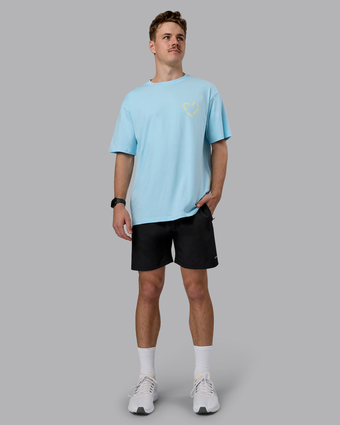 Man wearing Love The Process FLXCotton Oversize Tee - Crystal Blue-Lemon | Model:Cameron | Size:M