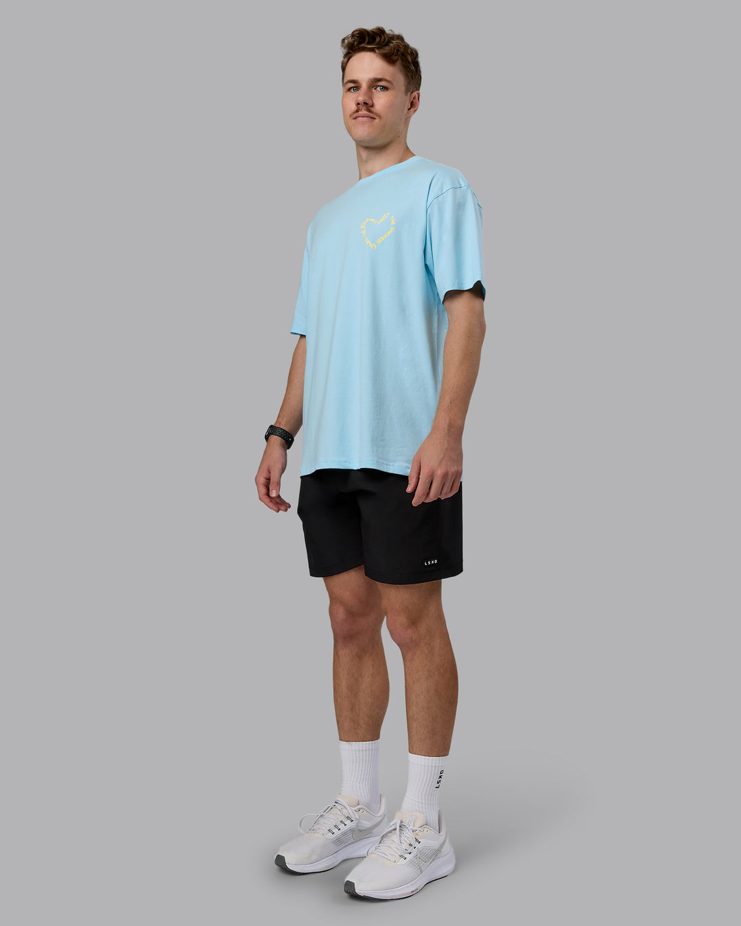 Man wearing Love The Process FLXCotton Oversize Tee - Crystal Blue-Lemon | Model:Cameron | Size:M