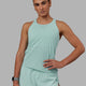 Woman wearing Accelerate Performance Tank - Pastel Turquoise