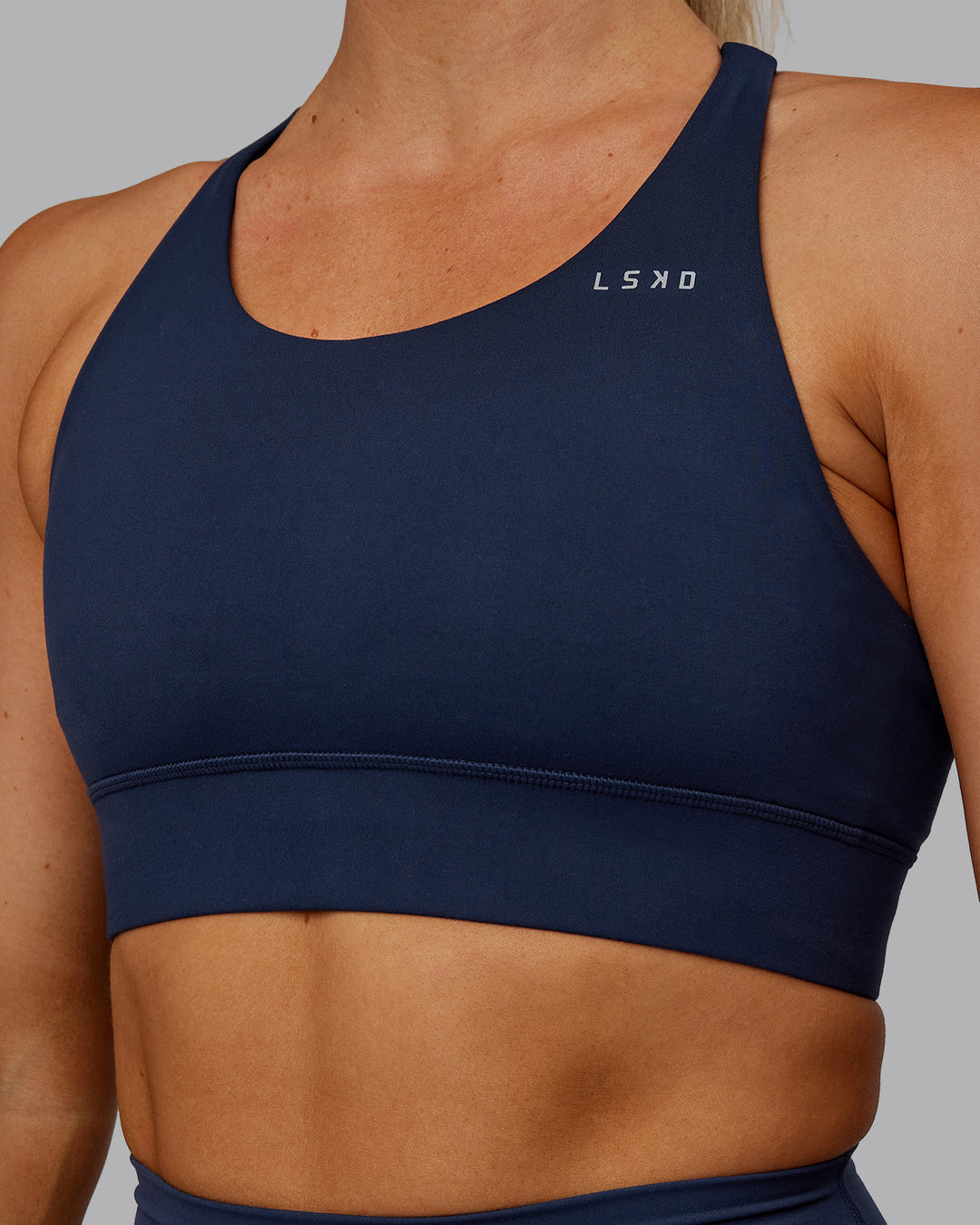 Woman wearing Accelerate Sports Bra - Future Navy | Model:Hannah | Size:S